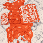 Tangy Orange Leheriya Cotton Unstitched Suit Set